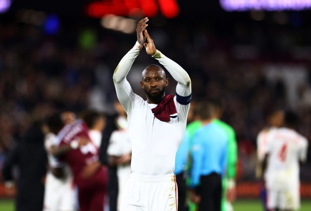 Olympique Lyonnais' Moussa Dembele applauds fans after the match